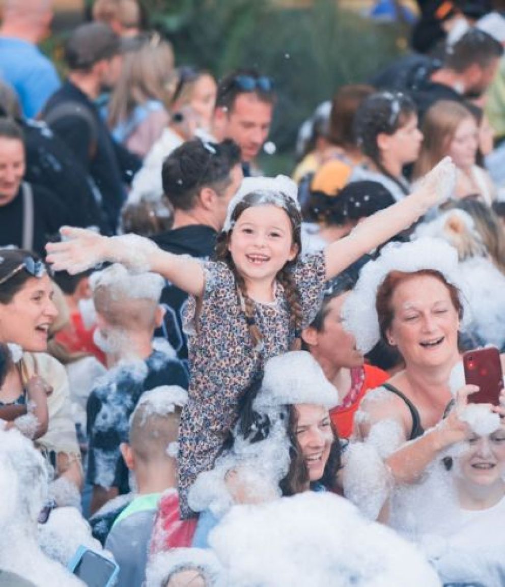 Smiling faces and people covered in bubbles